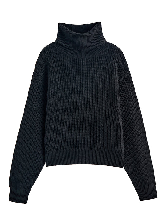 Flatlay photo of Naia in black. The sweater is oversized and cropped and made of cashmere and recycled cashmere. The sweater is a ribbed knit turtleneck.