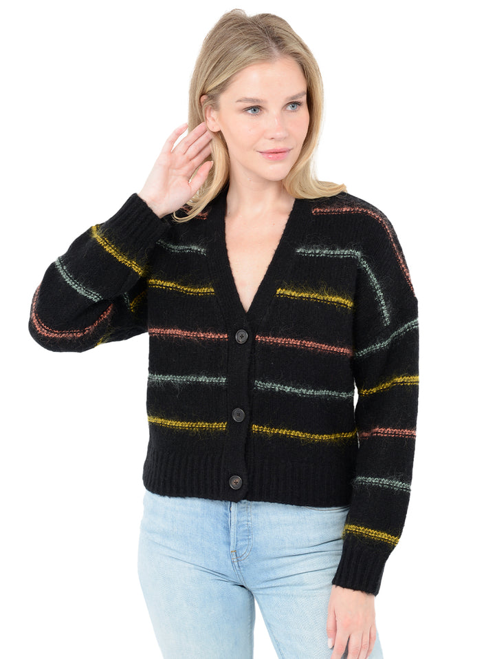 Front facing shot of model wearing Micaela in black. The sweater is oversized and cropped and made of wool and cashmere with contrasting stripes in wool, nylon, and mohair.
