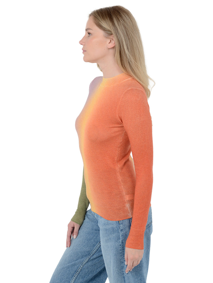 Side view shot of model wearing Zorina in dayglow. The sweater is fitted and made of 100% cashmere. The sweater is a mock neck and features a horizontal gradient.