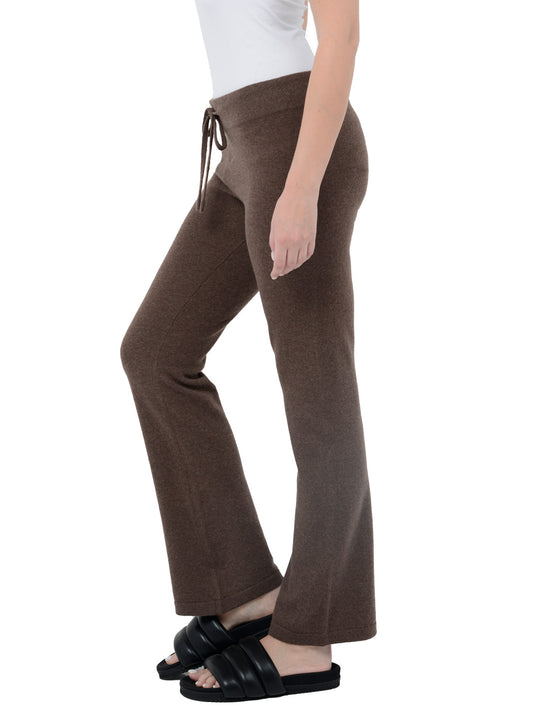 Side view of model wearing Kaite in cocoa brown. The lounge pants are straight fit and made of cashmere and recycled cashmere.