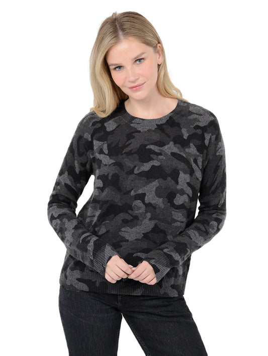 Alternate front facing shot of model wearing Tasha in black. The sweater is straight fit and made of cashmere. The pullover has a all-over camouflage print