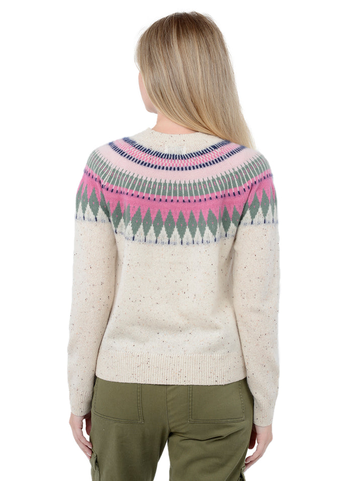 Back facing shot of model wearing Salena in Pebble Cream. The sweater is relaxed and made of 100% cashmere. The sweater also sports a fairisle knit design across the chest and neck.